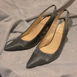 Louboutin satin heels.  Elegant, and sophisticated.  Holiday expressions!